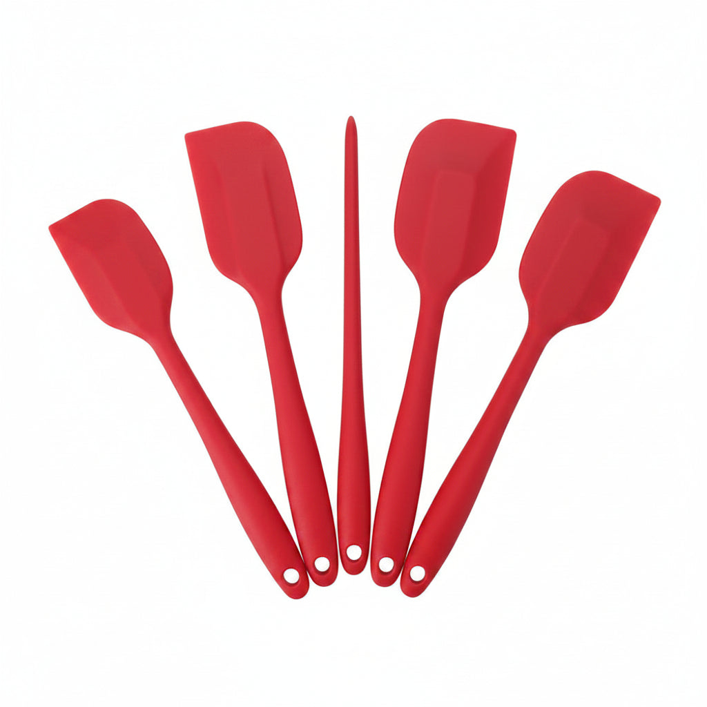Set of red silicone spatulas on a white background